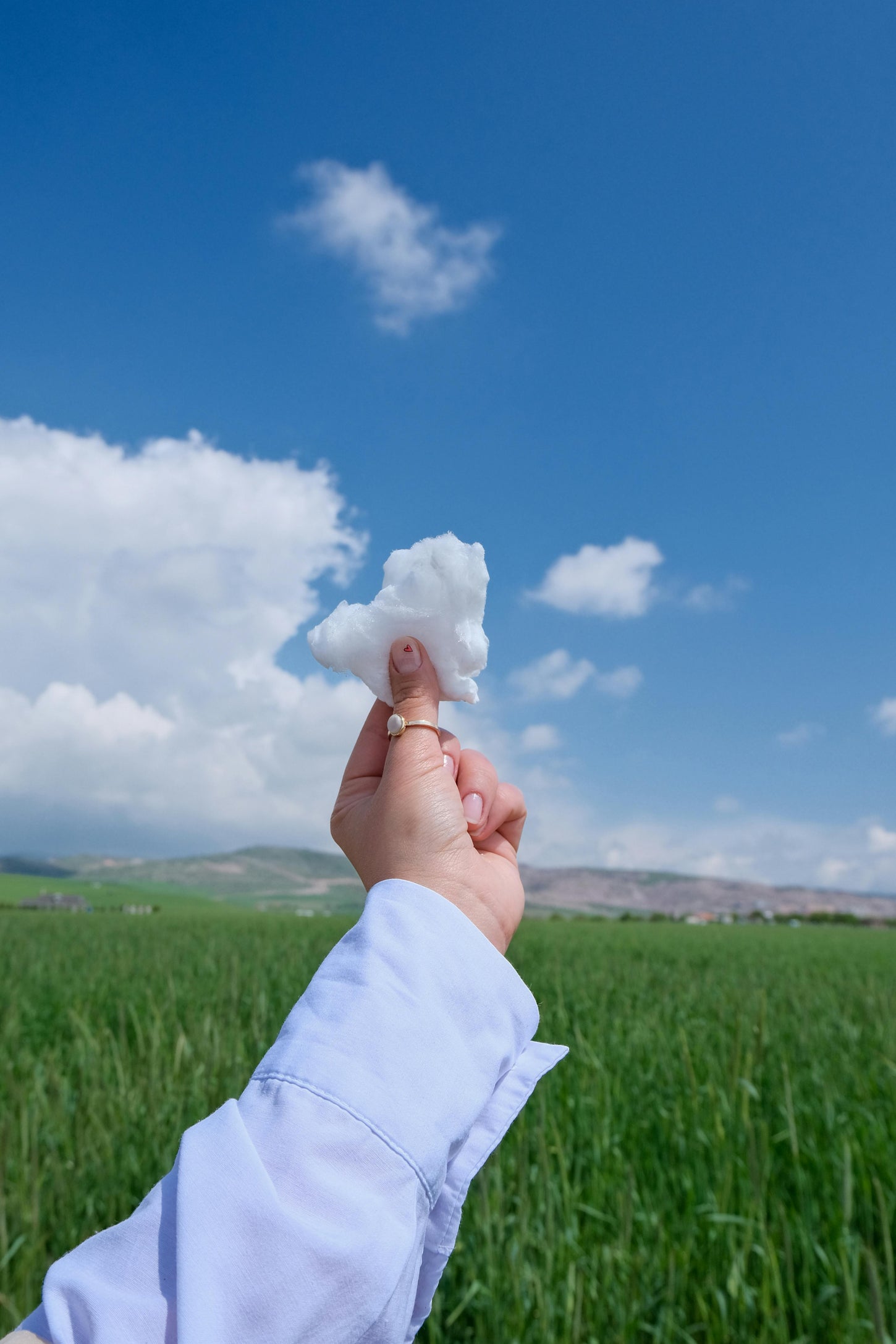 A piece of cotton holding in a girls hand representing that we're the change.